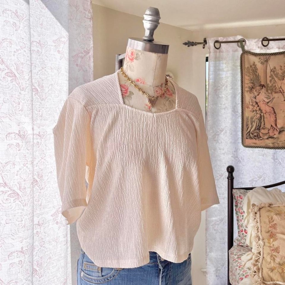 anthropologie cream babydoll top